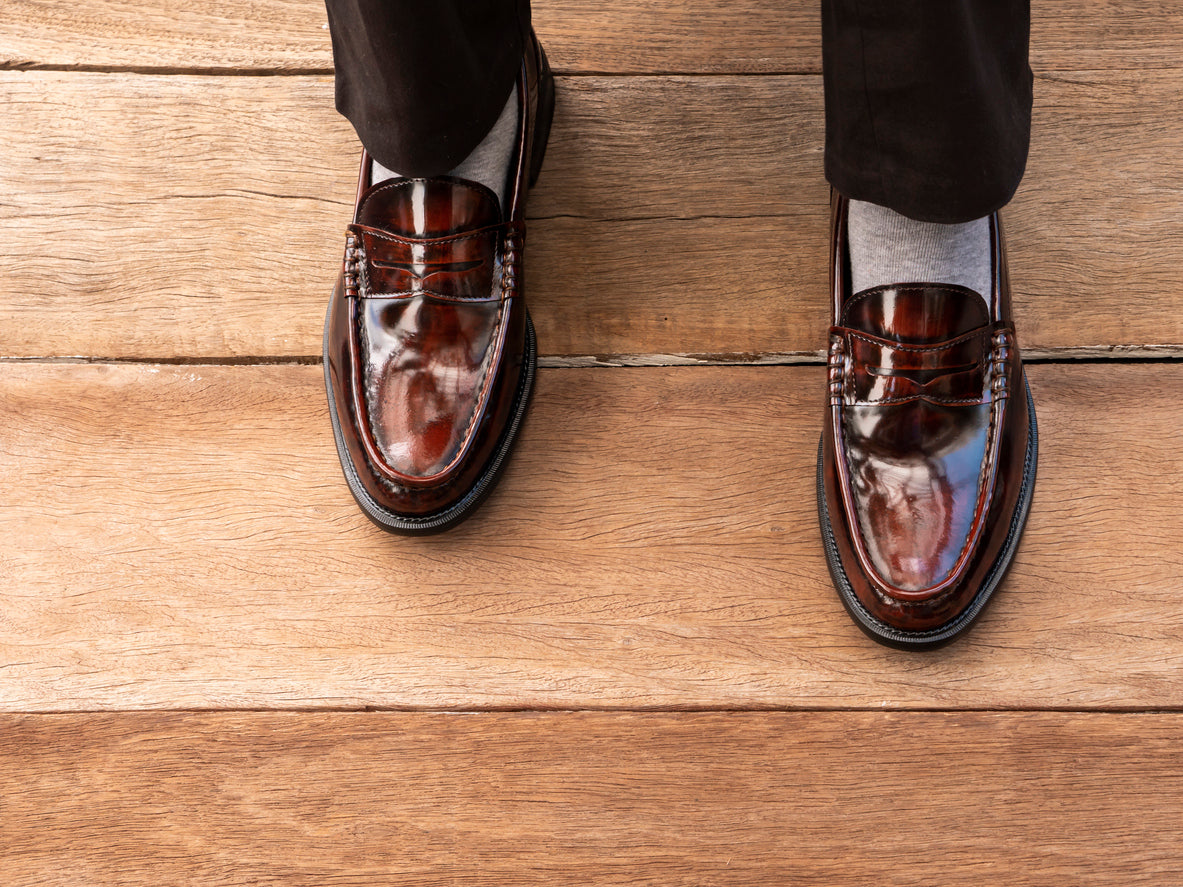 Men's brown loafers with Grey Socks and Black Slacks